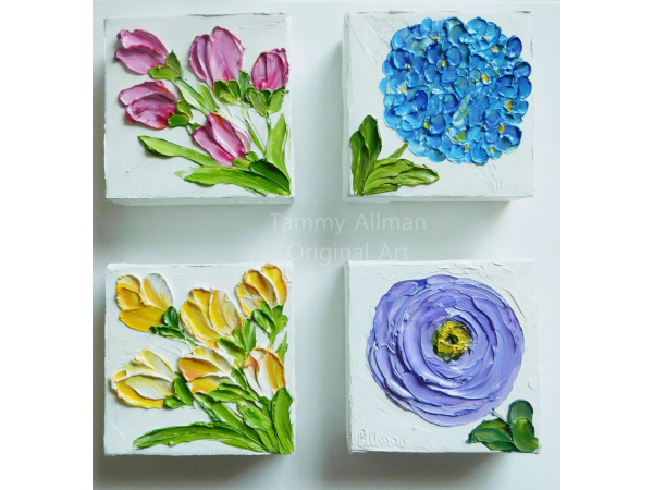 group of small paintings on a wall