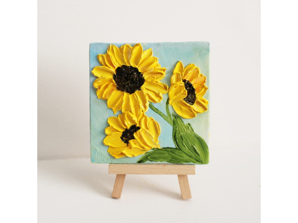 small sunflower painting on a easel